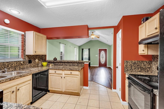 3005 Robalo Dr, Gautier, MS 39553 - kitchen featuring under cabinet range hood, black appliances, light brown cabinets, a peninsula, and lofted ceiling