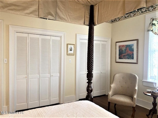 707 State St Unit 705, Natchez, MS 39120 - bedroom featuring multiple closets, baseboards, and wood finished floors
