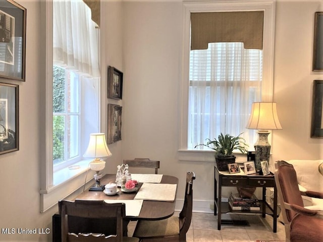 707 State St Unit 705, Natchez, MS 39120 - dining space with tile patterned floors and baseboards