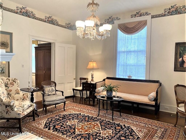 707 State St Unit 705, Natchez, MS 39120 - sitting room with a chandelier, wood finished floors, and baseboards