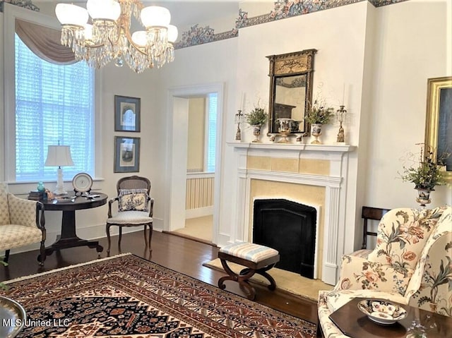 707 State St Unit 705, Natchez, MS 39120 - living area with wood finished floors, a chandelier, and a fireplace