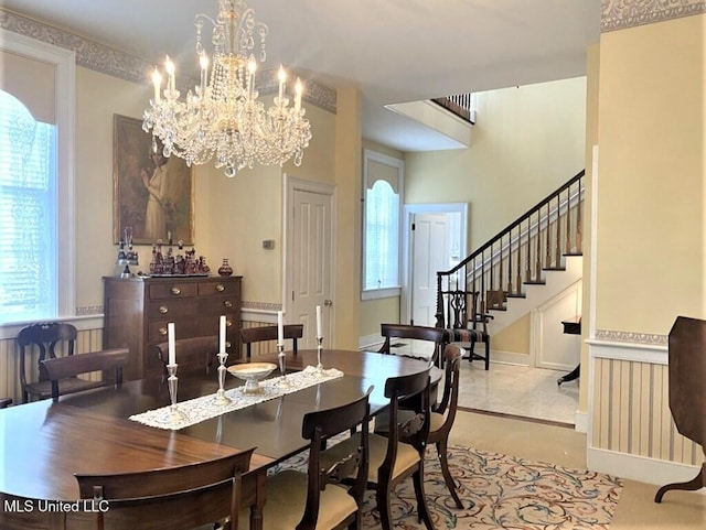 707 State St Unit 705, Natchez, MS 39120 - dining room with healthy amount of natural light, stairway, and a chandelier