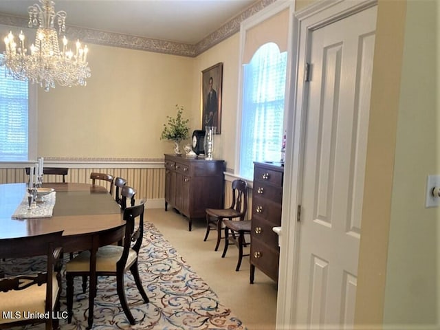 707 State St Unit 705, Natchez, MS 39120 - dining space featuring plenty of natural light, a chandelier, and light colored carpet