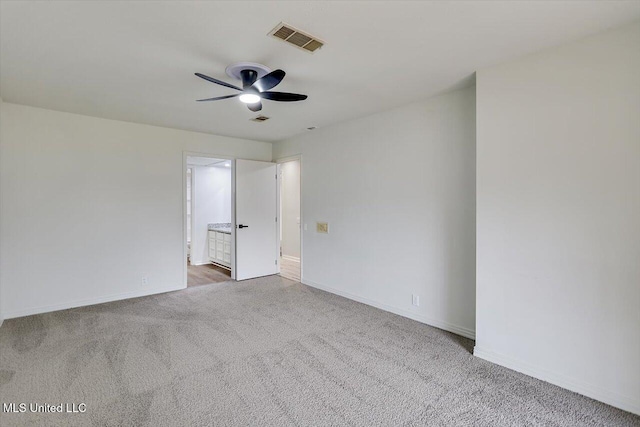 unfurnished room featuring carpet and ceiling fan