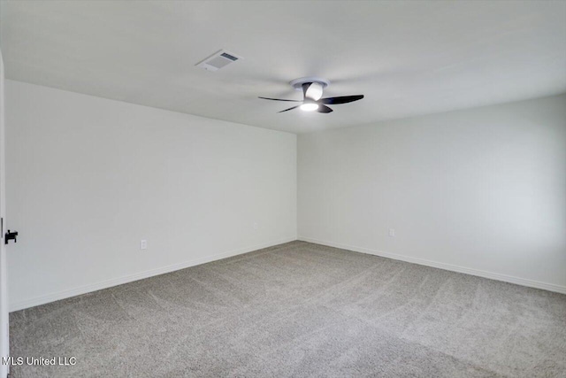 carpeted empty room featuring ceiling fan