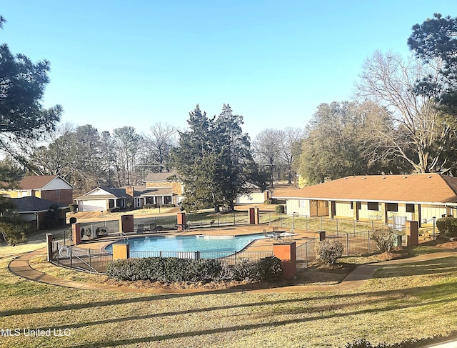 view of pool featuring a yard