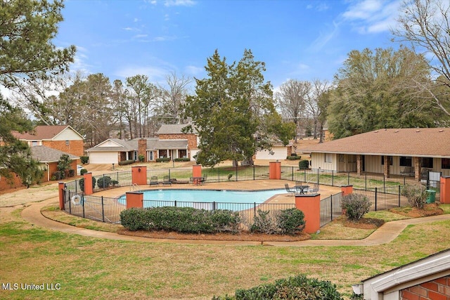 view of pool with a yard