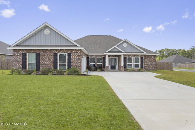 6108 Penni Ln, Ocean Springs, MS 39564 - view of front facade featuring brick siding, concrete driveway, roof with shingles, and board and batten siding