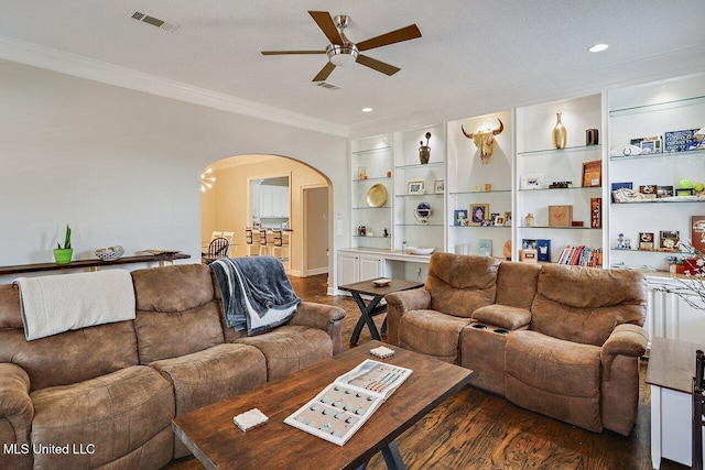 30 Charleston Cir, Brandon, MS 39047 - living room featuring arched walkways, ceiling fan, ornamental molding, wood finished floors, and built in shelves