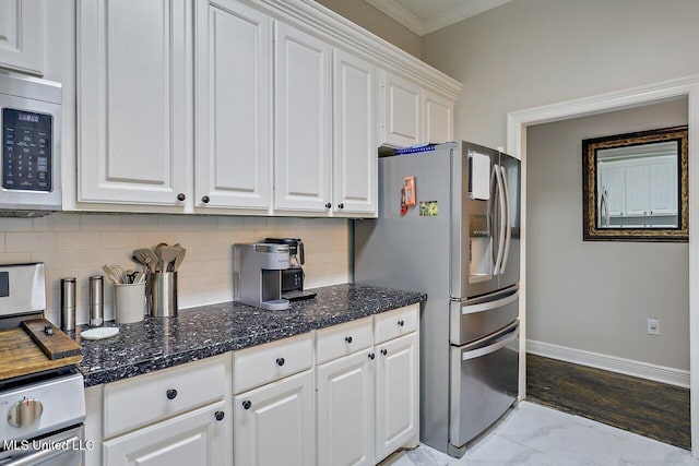 30 Charleston Cir, Brandon, MS 39047 - kitchen with stainless steel appliances, white cabinetry, crown molding, tasteful backsplash, and light marble finish floors
