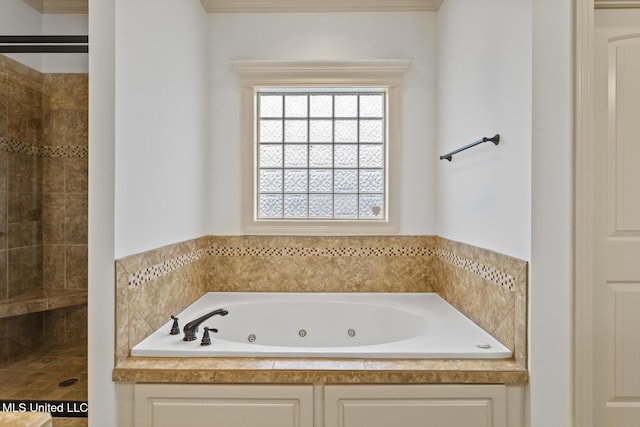 130 Camden Xing, Madison, MS 39110 - bathroom featuring a whirlpool tub, a tile shower, and ornamental molding