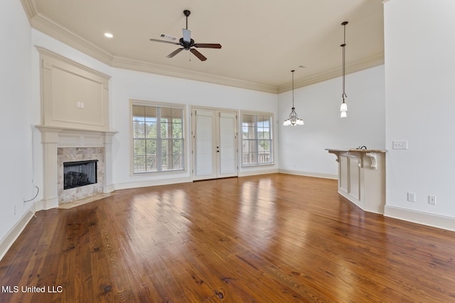 130 Camden Xing, Madison, MS 39110 - unfurnished living room featuring a ceiling fan, wood finished floors, a premium fireplace, crown molding, and baseboards