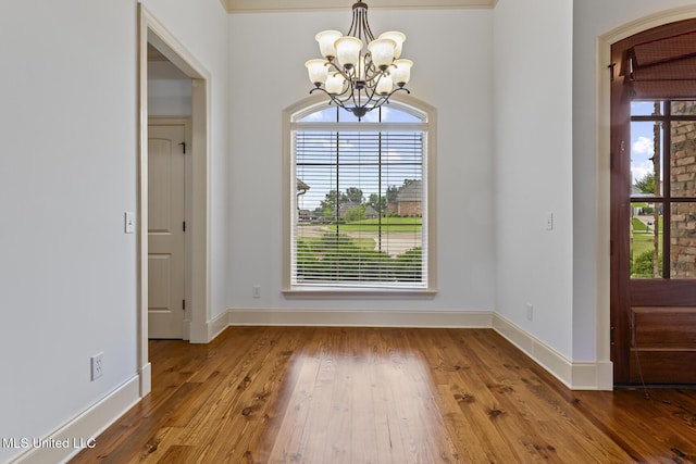 130 Camden Xing, Madison, MS 39110 - unfurnished dining area featuring a chandelier, healthy amount of natural light, and wood finished floors