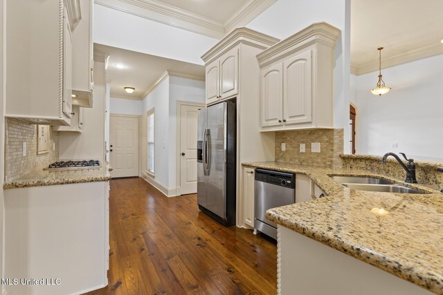 130 Camden Xing, Madison, MS 39110 - kitchen featuring stainless steel appliances, ornamental molding, a sink, light stone countertops, and dark wood finished floors