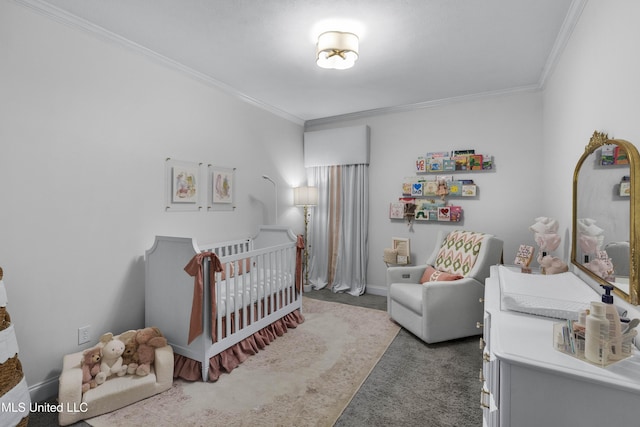 bedroom with ornamental molding, carpet, and a crib