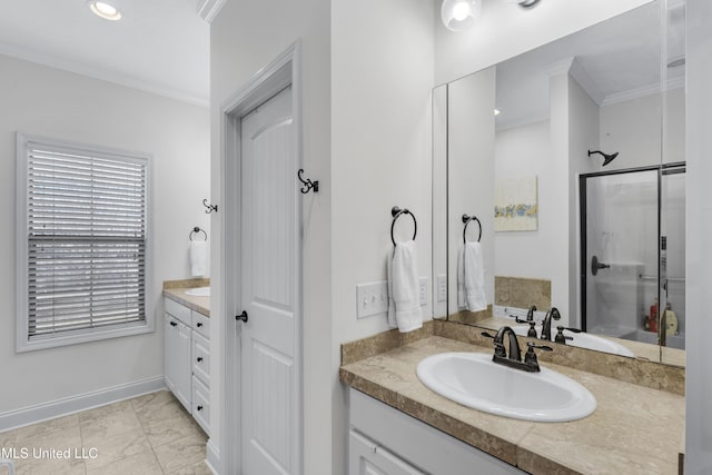 bathroom with crown molding, vanity, and a shower with shower door