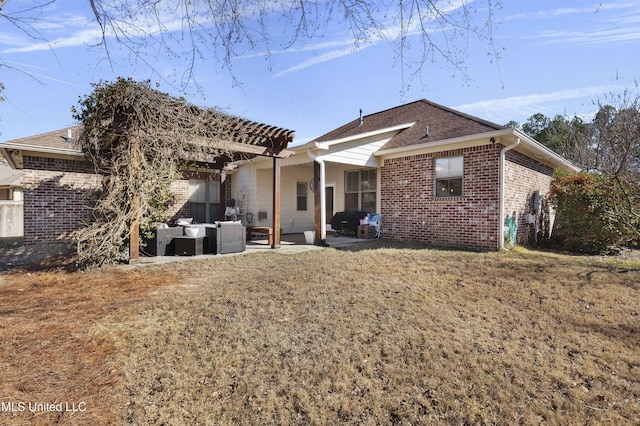 rear view of house featuring a patio, outdoor lounge area, a yard, and a pergola