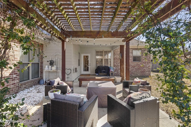 view of patio with area for grilling, an outdoor living space, and a pergola