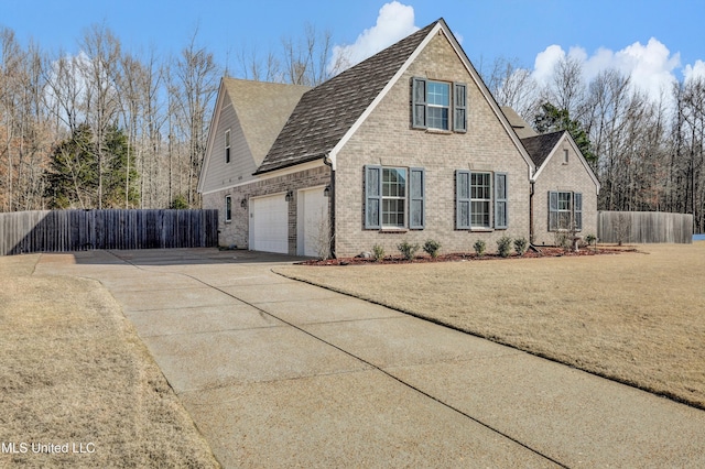 view of front facade with a front yard and a garage