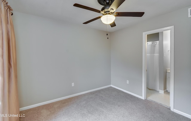 unfurnished bedroom with carpet floors, baseboards, and a ceiling fan