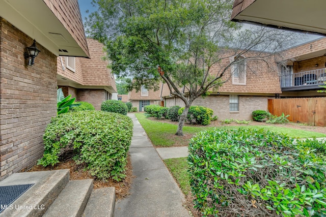 view of property's community with fence