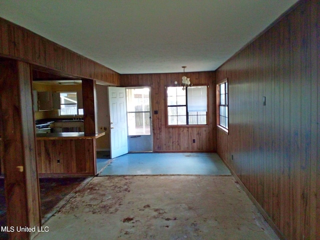 218 Summerhaven Dr, Yazoo City, MS 39194 - unfurnished living room featuring baseboards and wooden walls