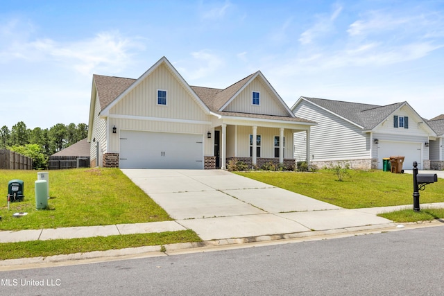 14864 Audubon Lake Blvd, Gulfport, MS 39503 - craftsman inspired home featuring a porch, concrete driveway, board and batten siding, and a shingled roof