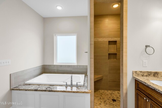 14864 Audubon Lake Blvd, Gulfport, MS 39503 - full bathroom featuring a garden tub, tiled shower, and vanity