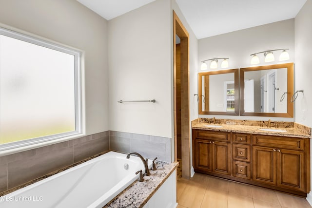 14864 Audubon Lake Blvd, Gulfport, MS 39503 - bathroom featuring double vanity, a garden tub, and tile patterned floors