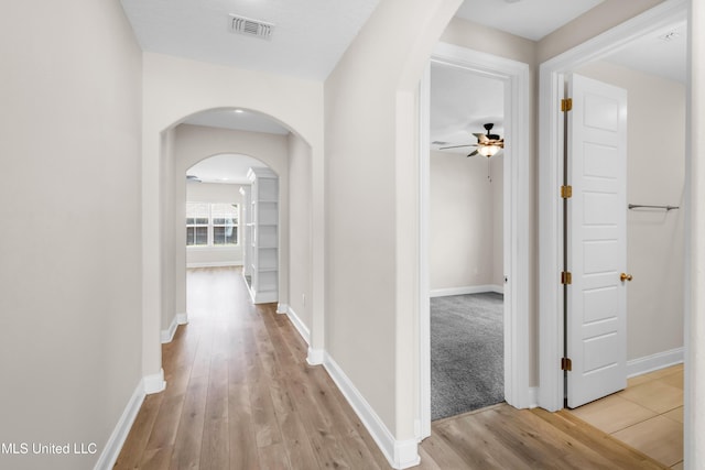 14864 Audubon Lake Blvd, Gulfport, MS 39503 - corridor featuring arched walkways and light wood-type flooring