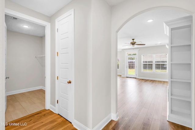 14864 Audubon Lake Blvd, Gulfport, MS 39503 - hall featuring arched walkways, wood finished floors, and recessed lighting