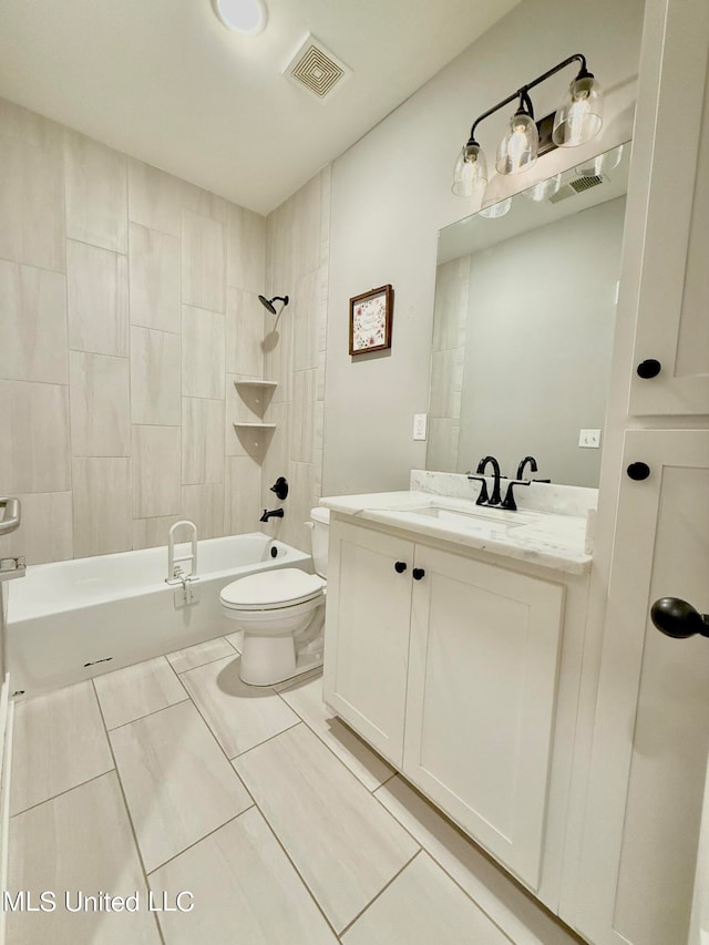 full bathroom with tiled shower / bath combo, vanity, and toilet