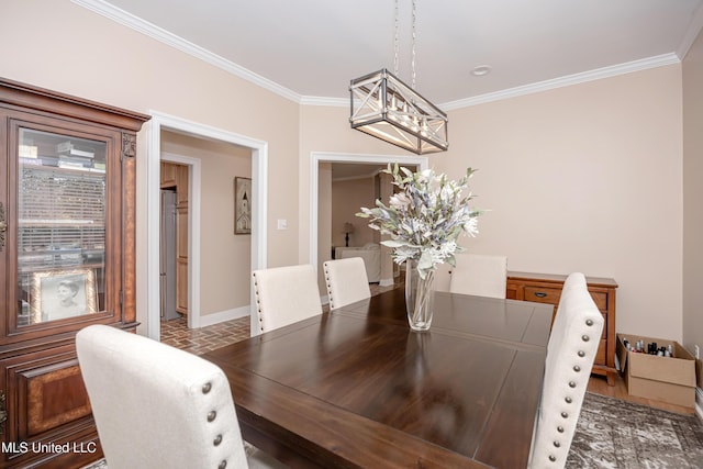 dining room featuring ornamental molding