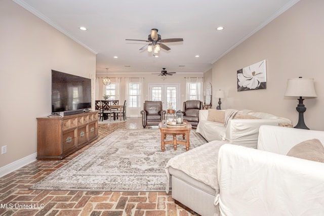 living room with ceiling fan and crown molding