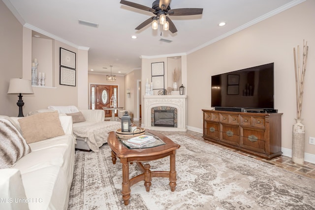 living room featuring ceiling fan and ornamental molding