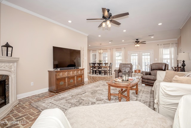 living room with french doors, ceiling fan, and crown molding