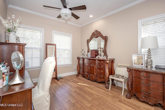 office space with ceiling fan, light hardwood / wood-style flooring, and a wealth of natural light