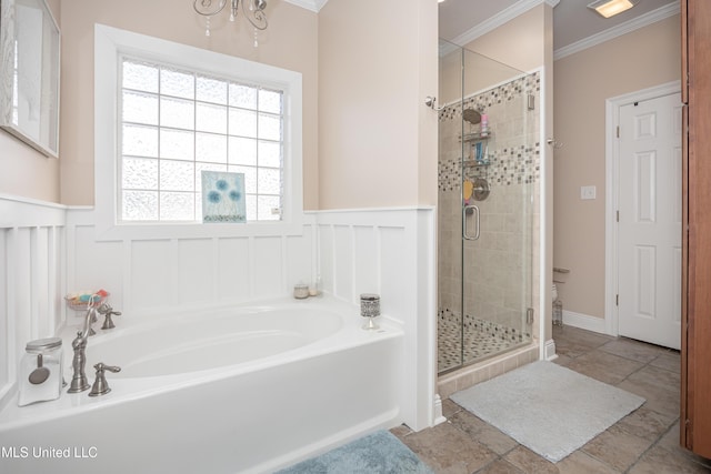 bathroom with shower with separate bathtub and ornamental molding