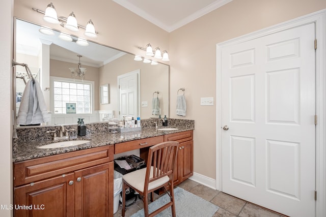 bathroom featuring an inviting chandelier, ornamental molding, tile patterned floors, and vanity