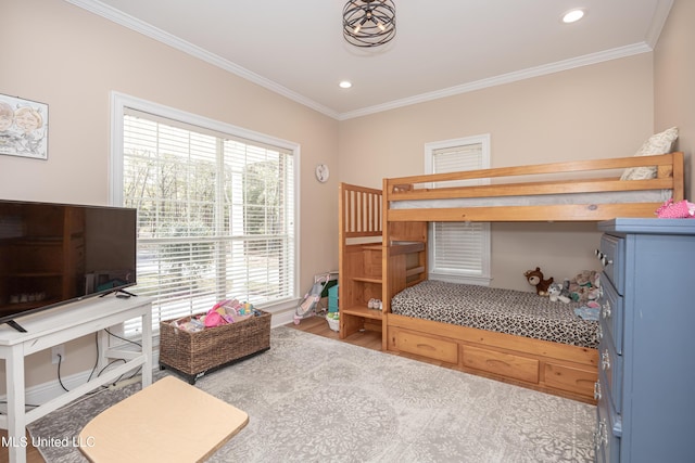 bedroom featuring light hardwood / wood-style floors and crown molding