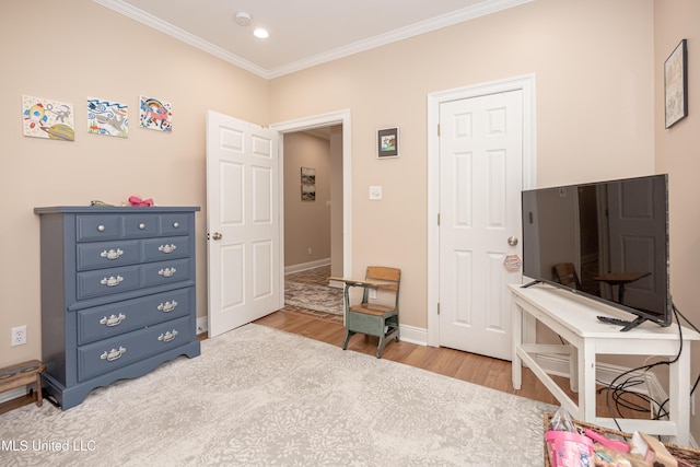 interior space with ornamental molding and light hardwood / wood-style floors