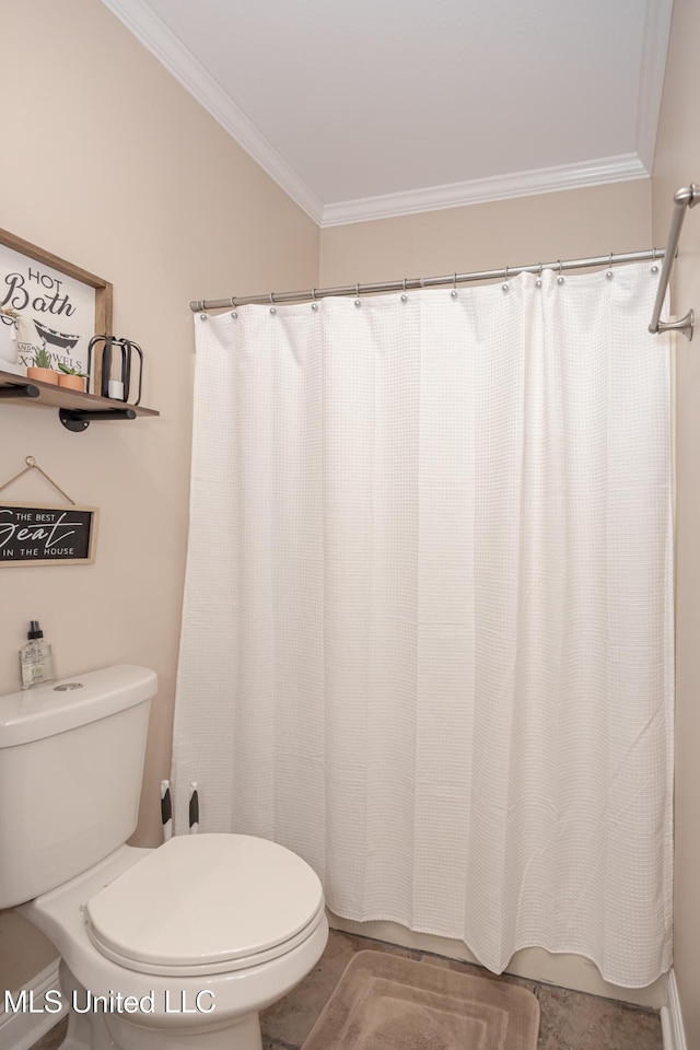 bathroom with toilet and ornamental molding