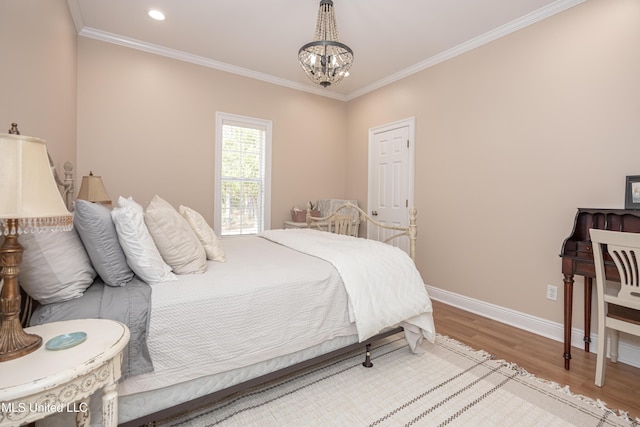 bedroom with crown molding, a chandelier, and wood-type flooring