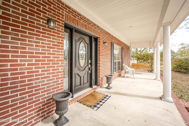 entrance to property with covered porch