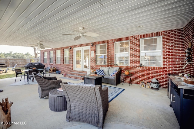 view of patio / terrace with ceiling fan and outdoor lounge area