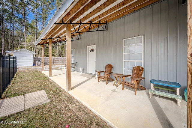 view of patio / terrace with a storage shed