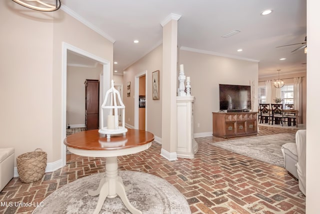 living room with ceiling fan and ornamental molding