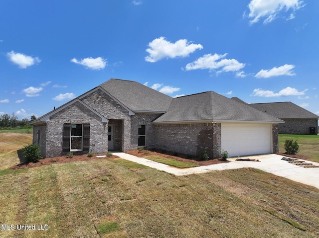 view of front of property with a garage, concrete driveway, roof with shingles, a front lawn, and brick siding