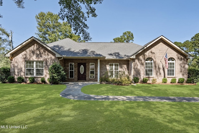 view of front of home with a front yard