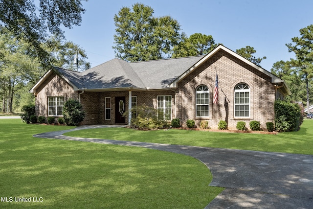 view of front of home with a front lawn